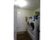 Bright laundry room featuring a washer and dryer set with ample storage space at 6651 Sonesta Dr, Indianapolis, IN 46217