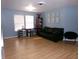 Cozy living room with a comfortable sofa, wooden bookcase, and natural lighting, perfect for relaxing at 6651 Sonesta Dr, Indianapolis, IN 46217