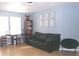 Comfortable living room with blue walls and a black leather sofa and modern decor at 6651 Sonesta Dr, Indianapolis, IN 46217
