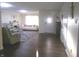 Open-concept living room with hardwood floors, modern furniture, and plenty of light at 6651 Sonesta Dr, Indianapolis, IN 46217