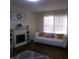 Bright living room with a white sofa and a decorative fireplace creating a cozy ambiance at 6651 Sonesta Dr, Indianapolis, IN 46217