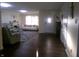 Spacious living room with a modern sofa, fireplace, and hardwood floors for a welcoming atmosphere at 6651 Sonesta Dr, Indianapolis, IN 46217
