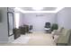 Comfortable main bedroom featuring neutral color walls, carpeted floors, and a home office area at 6651 Sonesta Dr, Indianapolis, IN 46217