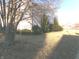 Well-manicured yard with mature trees and bushes, offering shade and curb appeal at 6651 Sonesta Dr, Indianapolis, IN 46217