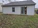 Exterior shot of the back of the house, featuring a sliding glass door leading to the interior at 7128 Moon Ct, Indianapolis, IN 46241