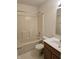 Standard bathroom with a tub-shower, toilet, and vanity with a sink at 7128 Moon Ct, Indianapolis, IN 46241