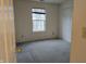 Basic bedroom with natural light, a closet, and wall-to-wall carpeting at 7128 Moon Ct, Indianapolis, IN 46241