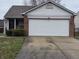 Charming single-story home with attached two-car garage, front entryway, and partial brick facade at 7128 Moon Ct, Indianapolis, IN 46241