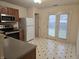 Kitchen with stainless steel appliances and access to backyard at 7128 Moon Ct, Indianapolis, IN 46241