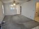 Unfurnished living room featuring a ceiling fan and open design at 7128 Moon Ct, Indianapolis, IN 46241