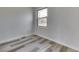 Cozy bedroom highlighting the natural light, sleek floors and neutral color palette at 7602 E 34Th Pl, Indianapolis, IN 46226