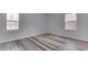 Bright bedroom filled with natural light features wood-look flooring and freshly painted walls at 7602 E 34Th Pl, Indianapolis, IN 46226