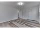 Spacious bedroom features wood-look floors, closet, and fresh paint at 7602 E 34Th Pl, Indianapolis, IN 46226