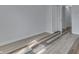 Bedroom featuring wood-look floors, closet, and fresh paint at 7602 E 34Th Pl, Indianapolis, IN 46226