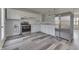 Eat-in kitchen featuring stainless steel appliances, modern lighting, and ample counter space at 7602 E 34Th Pl, Indianapolis, IN 46226