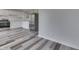 Modern kitchen featuring stainless steel appliances, white cabinetry, and stylish flooring at 7602 E 34Th Pl, Indianapolis, IN 46226