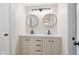 Bathroom vanity features dual mirrors, great cabinet space and modern fixtures at 8 Greenwood Trail S Dr, Greenwood, IN 46142