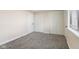 Bedroom with plush carpets has a window for light and two large closets at 8 Greenwood Trail S Dr, Greenwood, IN 46142