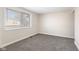 Cozy bedroom with plush carpet features a large window that fills the room with light at 8 Greenwood Trail S Dr, Greenwood, IN 46142