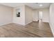 Spacious room with view to kitchen, light walls, modern flooring and recessed lighting at 8 Greenwood Trail S Dr, Greenwood, IN 46142