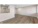 Open concept living area featuring wood-look floors, recessed lighting, and open view to kitchen at 8 Greenwood Trail S Dr, Greenwood, IN 46142