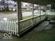 A covered porch view showing the neighborhood with white picket fence at 8445 Montery Rd, Indianapolis, IN 46226