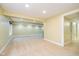 Spacious and well-lit basement with neutral walls and carpet with doorway to another room at 8808 Manderley Dr, Indianapolis, IN 46240