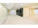 Spacious basement featuring neutral carpet, recessed lighting, and a custom-built entertainment center at 8808 Manderley Dr, Indianapolis, IN 46240