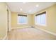 A room with two windows that provide natural light into the carpeted basement at 8808 Manderley Dr, Indianapolis, IN 46240