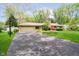 Charming ranch-style home with long driveway and attached two car garage at 8808 Manderley Dr, Indianapolis, IN 46240