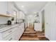 Modern kitchen featuring white cabinets, granite countertops, and stainless steel appliances at 8808 Manderley Dr, Indianapolis, IN 46240