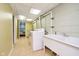 Utility room featuring a laundry tub and machines, with a doorway to another room at 8808 Manderley Dr, Indianapolis, IN 46240