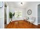 Bright room with french doors leading to porch and wood floors at 8808 Manderley Dr, Indianapolis, IN 46240
