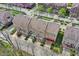 Beautiful aerial view of a townhome complex with well-manicured landscaping and vibrant spring foliage at 918 Rosalind Pl, Carmel, IN 46032