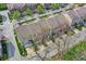 Scenic aerial of townhomes showing well-kept roofs and landscaping, including tree coverage at 918 Rosalind Pl, Carmel, IN 46032