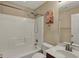 Bathroom with a combined tub and shower unit, plus a vanity and mirror at 918 Rosalind Pl, Carmel, IN 46032