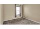 Cozy bedroom with neutral walls, plush carpet and natural light from the window at 918 Rosalind Pl, Carmel, IN 46032