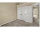Bedroom featuring a closet, neutral walls, and plush carpet with an open doorway to the hall at 918 Rosalind Pl, Carmel, IN 46032