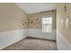 Bedroom with playful animal decals on the walls, plus wainscoting and plush carpet at 918 Rosalind Pl, Carmel, IN 46032