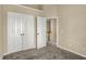 Bedroom featuring a closet, neutral walls, plush carpet and easy access to the staircase at 918 Rosalind Pl, Carmel, IN 46032