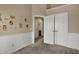 Bedroom decorated with animal themed wall stickers, plush carpet, and a large closet at 918 Rosalind Pl, Carmel, IN 46032