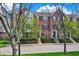 Brick townhome exterior featuring well-manicured landscaping and a welcoming entrance at 918 Rosalind Pl, Carmel, IN 46032