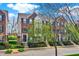 Brick townhome exterior showcasing lush landscaping and well-maintained curb appeal at 918 Rosalind Pl, Carmel, IN 46032