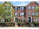 Charming brick townhome featuring classic architectural details and well-maintained landscaping at 918 Rosalind Pl, Carmel, IN 46032
