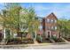 Beautiful brick townhomes with well-kept lawns, classic black shutters, and fresh landscaping at 918 Rosalind Pl, Carmel, IN 46032