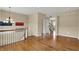 Open space with hardwood floors, staircase, chandelier, and ample natural light at 918 Rosalind Pl, Carmel, IN 46032