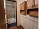A functional bathroom with a shower-tub combo and an oak vanity with great storage options at 10960 Marlin Rd, Indianapolis, IN 46239