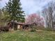 Beautiful home with inviting curb appeal, featuring mature trees and lush greenery at 10960 Marlin Rd, Indianapolis, IN 46239