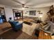 Inviting living room featuring comfortable seating, a ceiling fan, and a decorative fireplace at 10960 Marlin Rd, Indianapolis, IN 46239