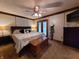 A spacious main bedroom with a ceiling fan, access to a balcony, and ample natural light at 10960 Marlin Rd, Indianapolis, IN 46239